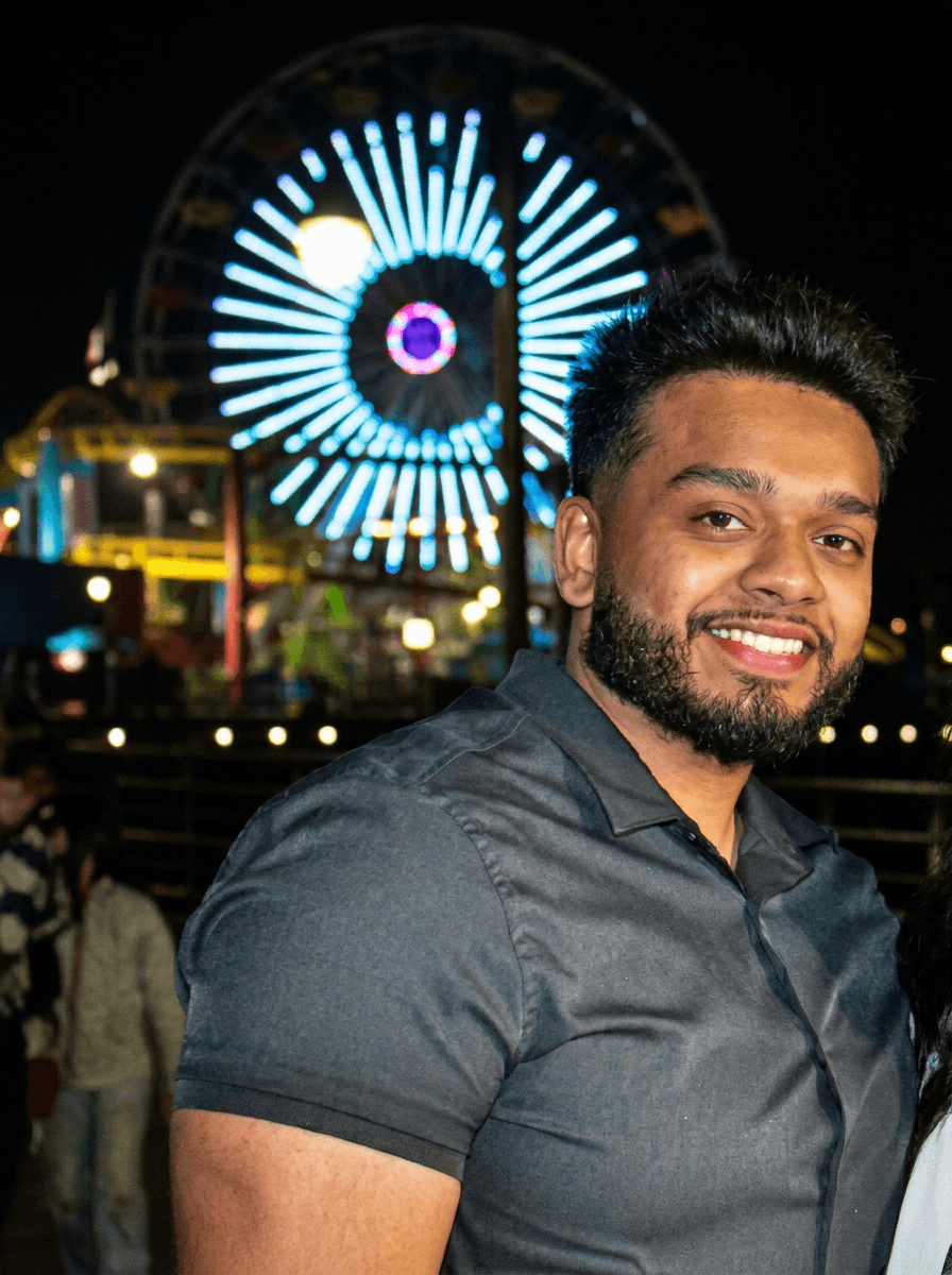 Portrait with ferris wheel lights in the background